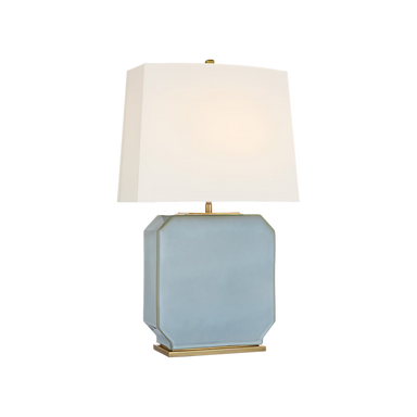 Table lamp with a light blue rectangular base and white shade on a white background