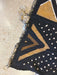 Decorative rug with geometric pattern on sand