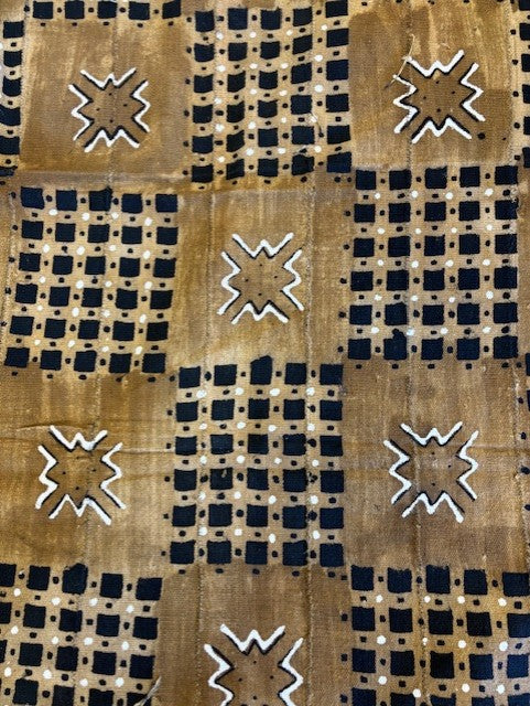 Textile with geometric patterns in brown, black, and white