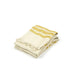 Folded towel with yellow stripes on a white background