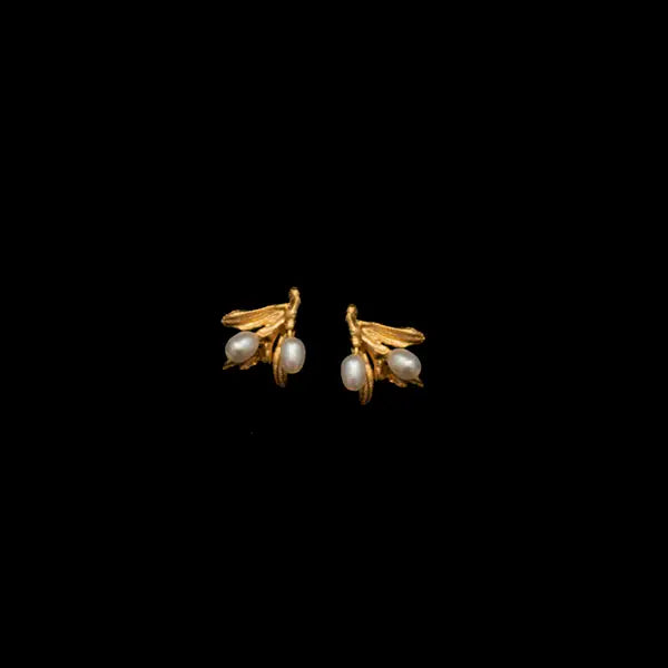 Pair of gold earrings with pearl-like beads on a black background
