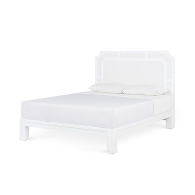 White bed frame with mattress on a white background