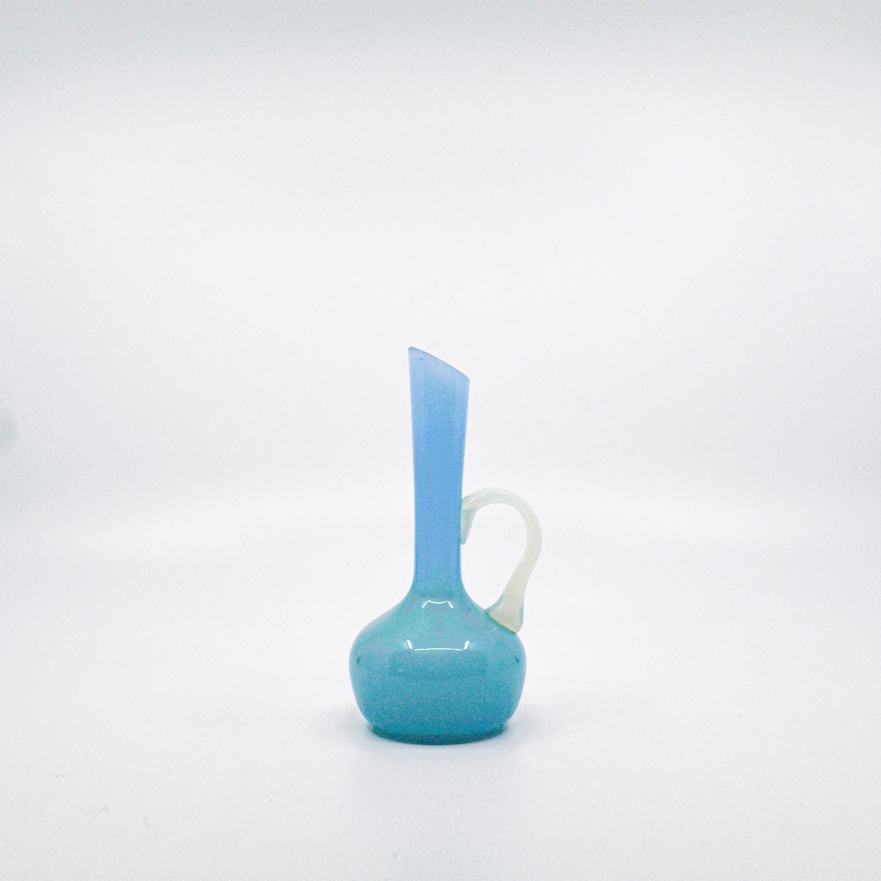 pale blue opaline pitcher with milky glass handle