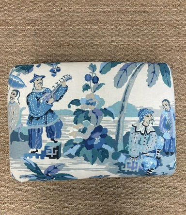 Fabric with blue and white pattern on a brown background