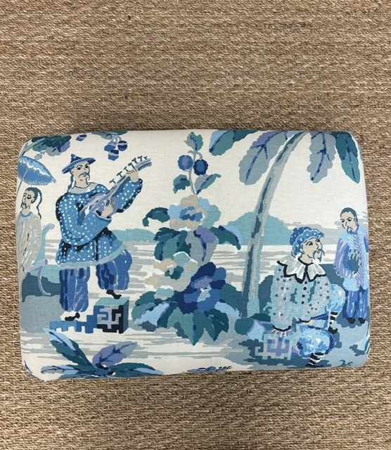 Fabric with blue and white pattern on a brown background