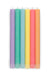 Set of six colorful candles in pastel shades on a white background