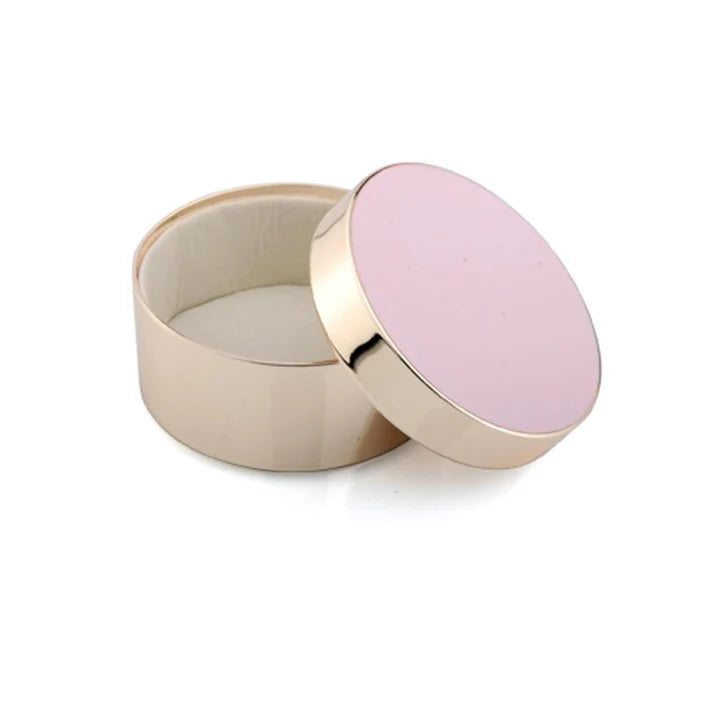 Round container with a pink lid on a white background