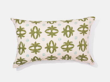 geometric green fleur de lis on white pillow