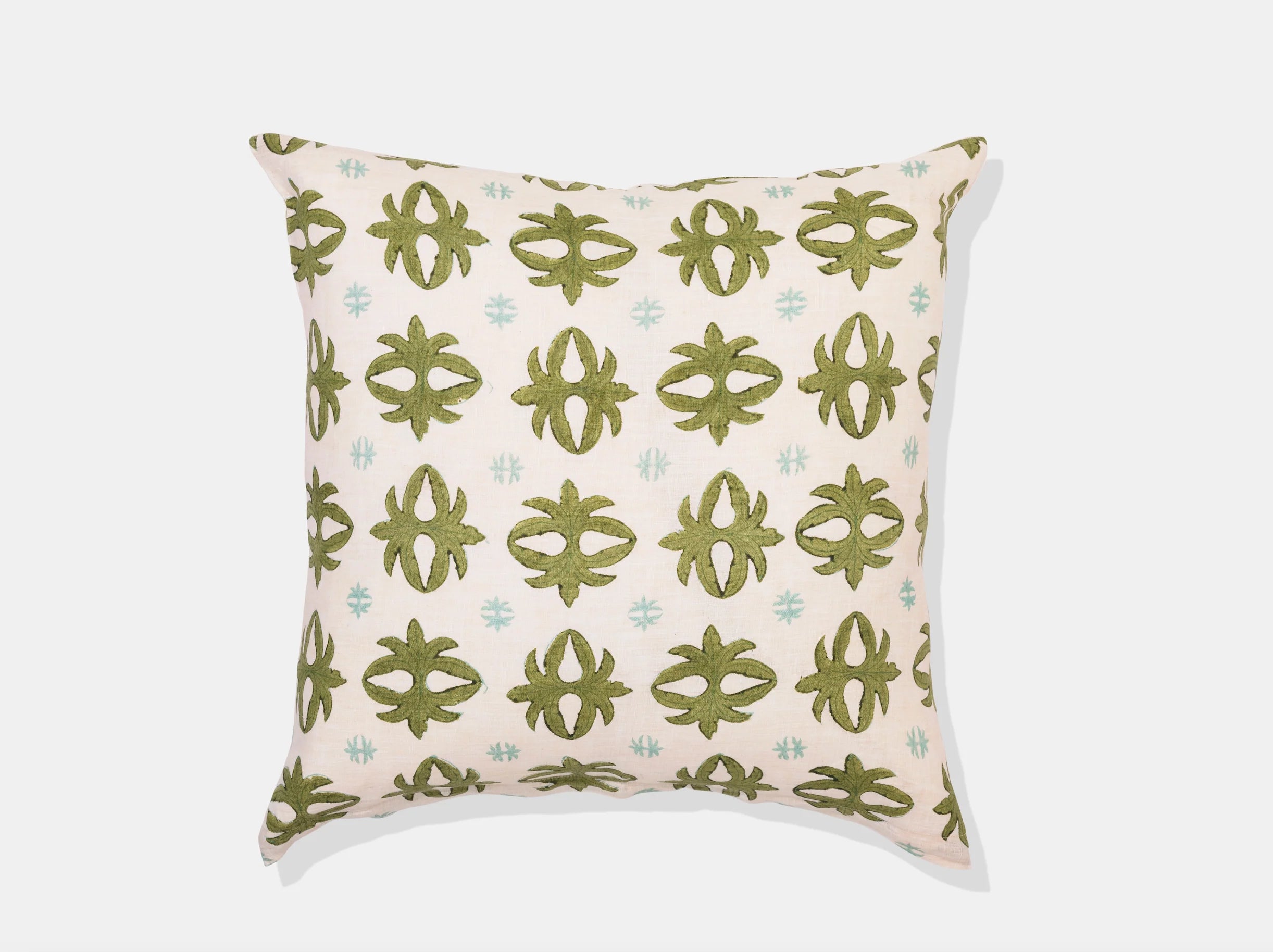 geometric green design on white pillow
