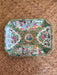 Decorative tray with intricate patterns on a woven surface
