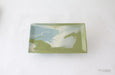 Rectangular ceramic dish with green and blue abstract design on a white background, branded 'Paul Schneider Ceramics'.