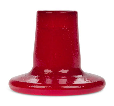 Red glass candleholder on a white background