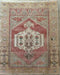 Decorative rug with geometric pattern on a wooden floor