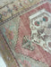 Close-up of a patterned rug with geometric designs.