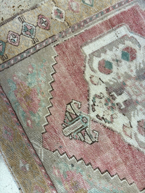 Close-up of a patterned rug with geometric designs.