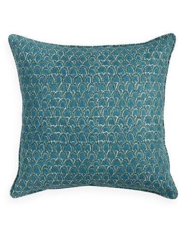 Teal patterned pillow on a white background