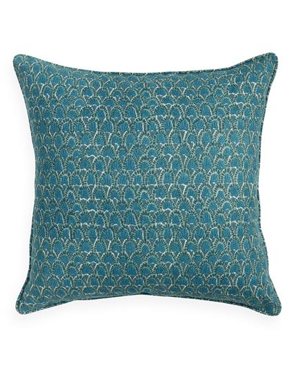 Teal patterned pillow on a white background