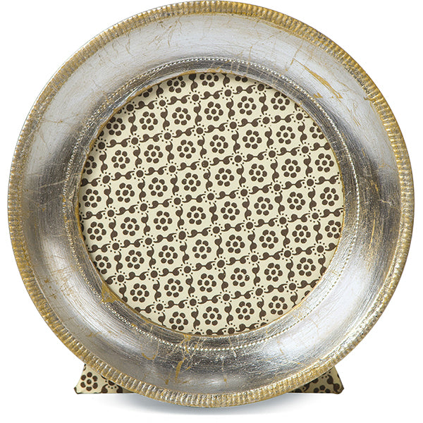 Decorative silver platter with intricate design on a white background
