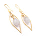 Gold earrings with white stones on a white background