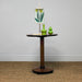 antique table set with green vases and artwork