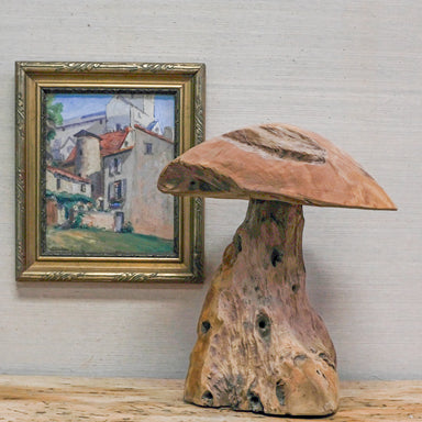wood mushroom sculpture with framed oil painting