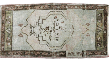wool persian rug wiht brown border and pale green center