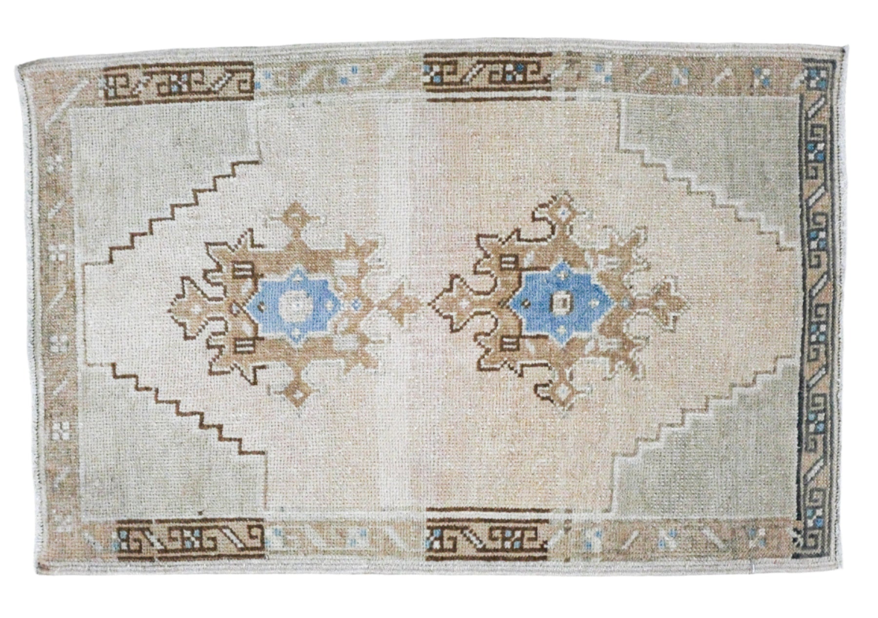 small turkish rug with bright blue center medallions