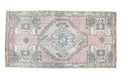 pale pink and blue centers in a wool rug