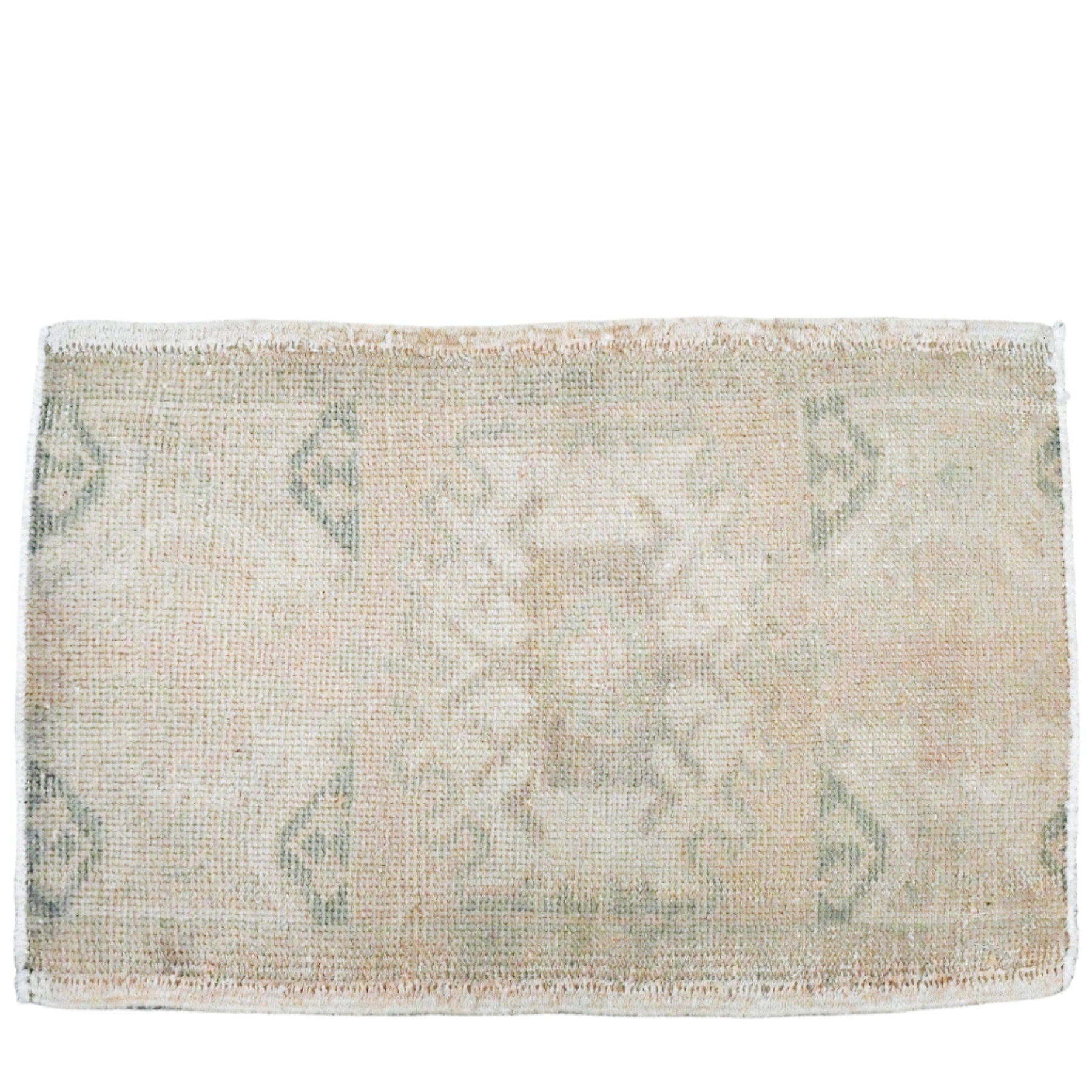 pale green and beige small wool rug