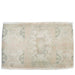 pale green and beige small wool rug