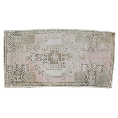 small pale pink oushak rug