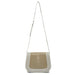 Beige and white crossbody bag on a white background