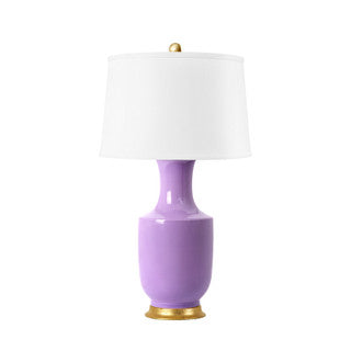Purple lamp with a white shade on a white background