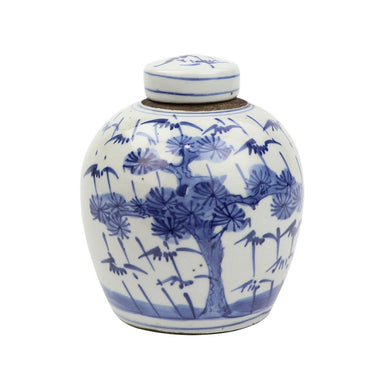 White ceramic jar with blue floral patterns on a white background