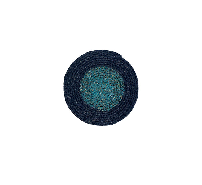 Round woven coaster with blue and black pattern on a white background