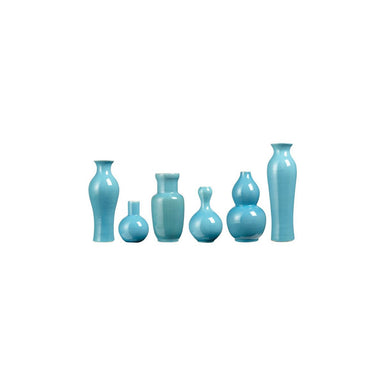 Set of turquoise vases of various shapes on a white background
