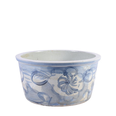 Ceramic planter with blue floral patterns on a white background