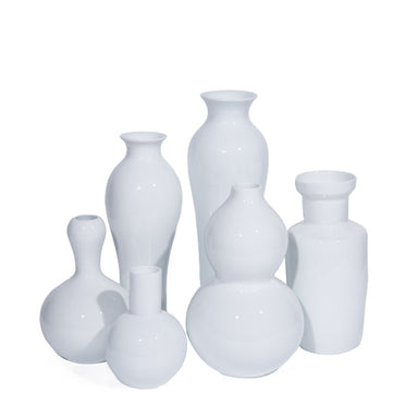 Set of white ceramic vases on a white background