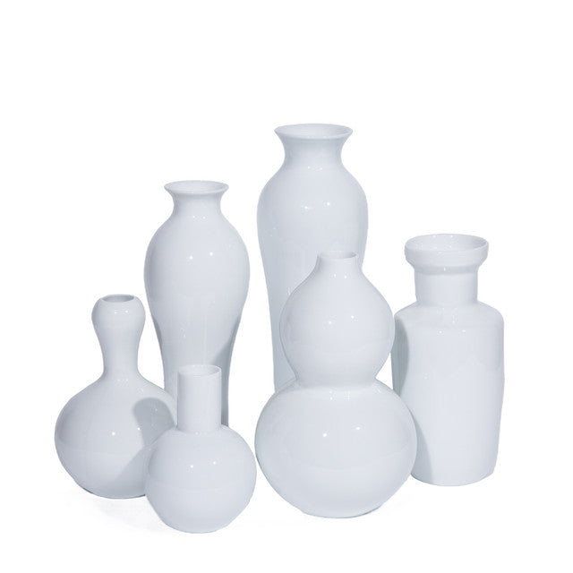 Set of white ceramic vases on a white background