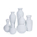 Set of white ceramic vases on a white background