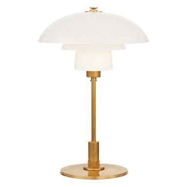 Table lamp with white shade and gold base on a white background