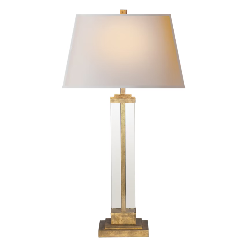 Table lamp with a clear glass base and lampshade on a white background