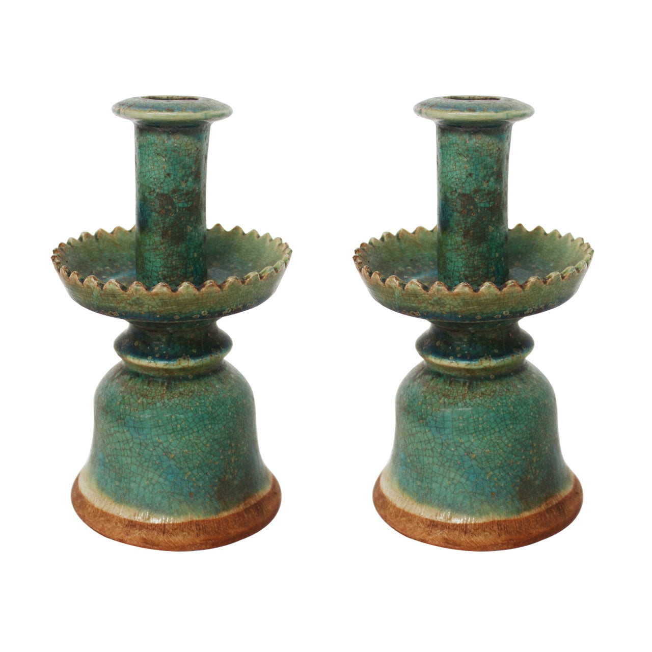 pair of green pottery candle holders with serrated edge design