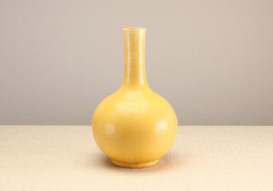 yellow long neck jar