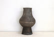 rustic handmade pottery vessel in dark grey