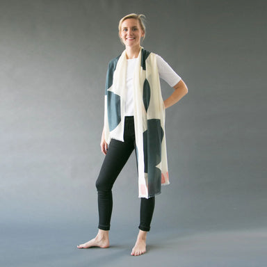 woman modeling white and gray merino wool scarf