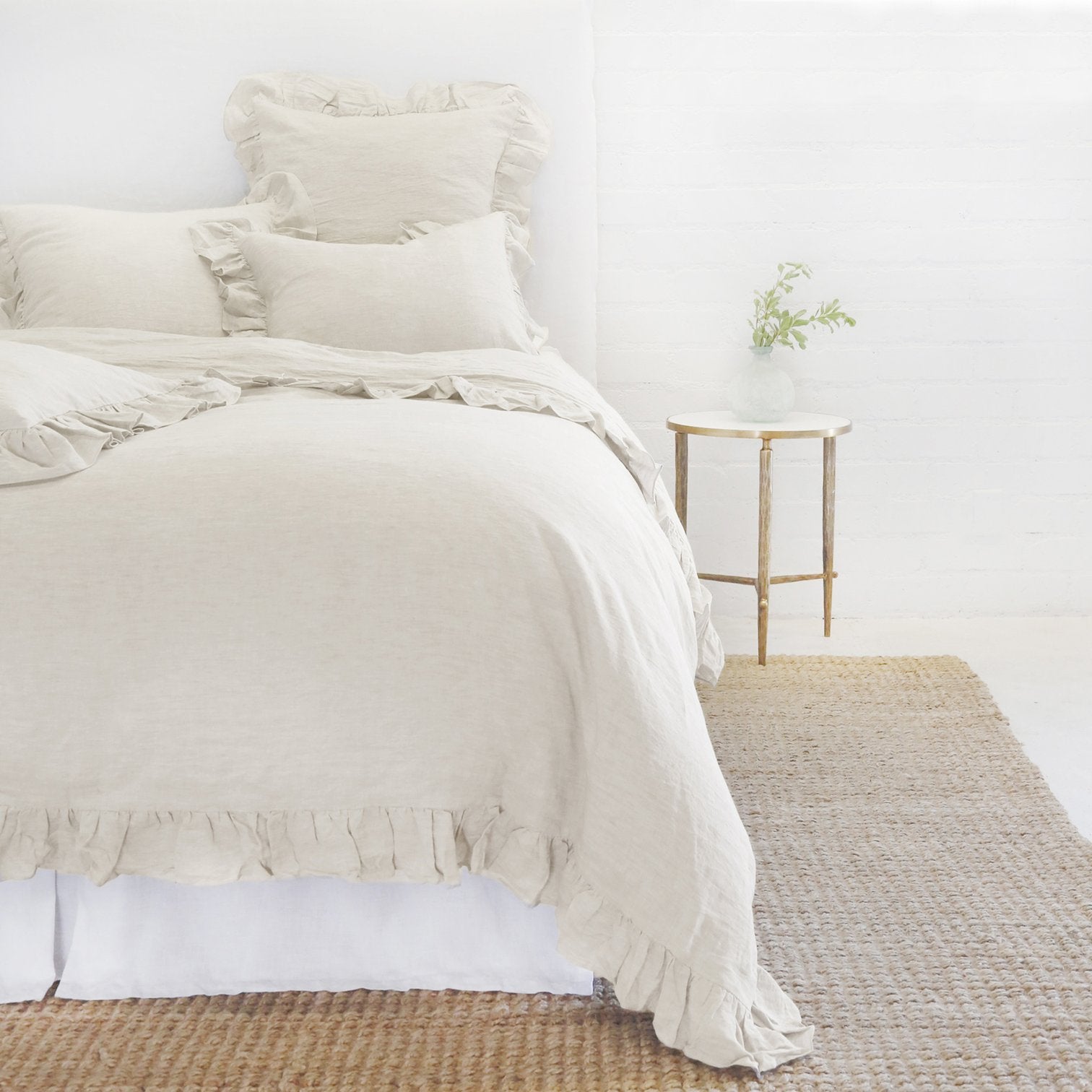 flax linen duvet cover and shams with ruffle on bed