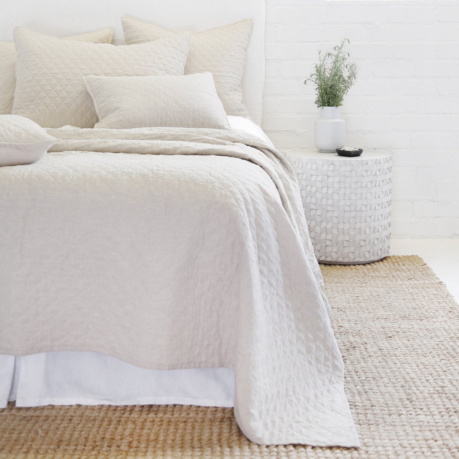 diamond quilted coverlet and shams on bed
