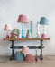 colorful lamps with colorful shades on antique table