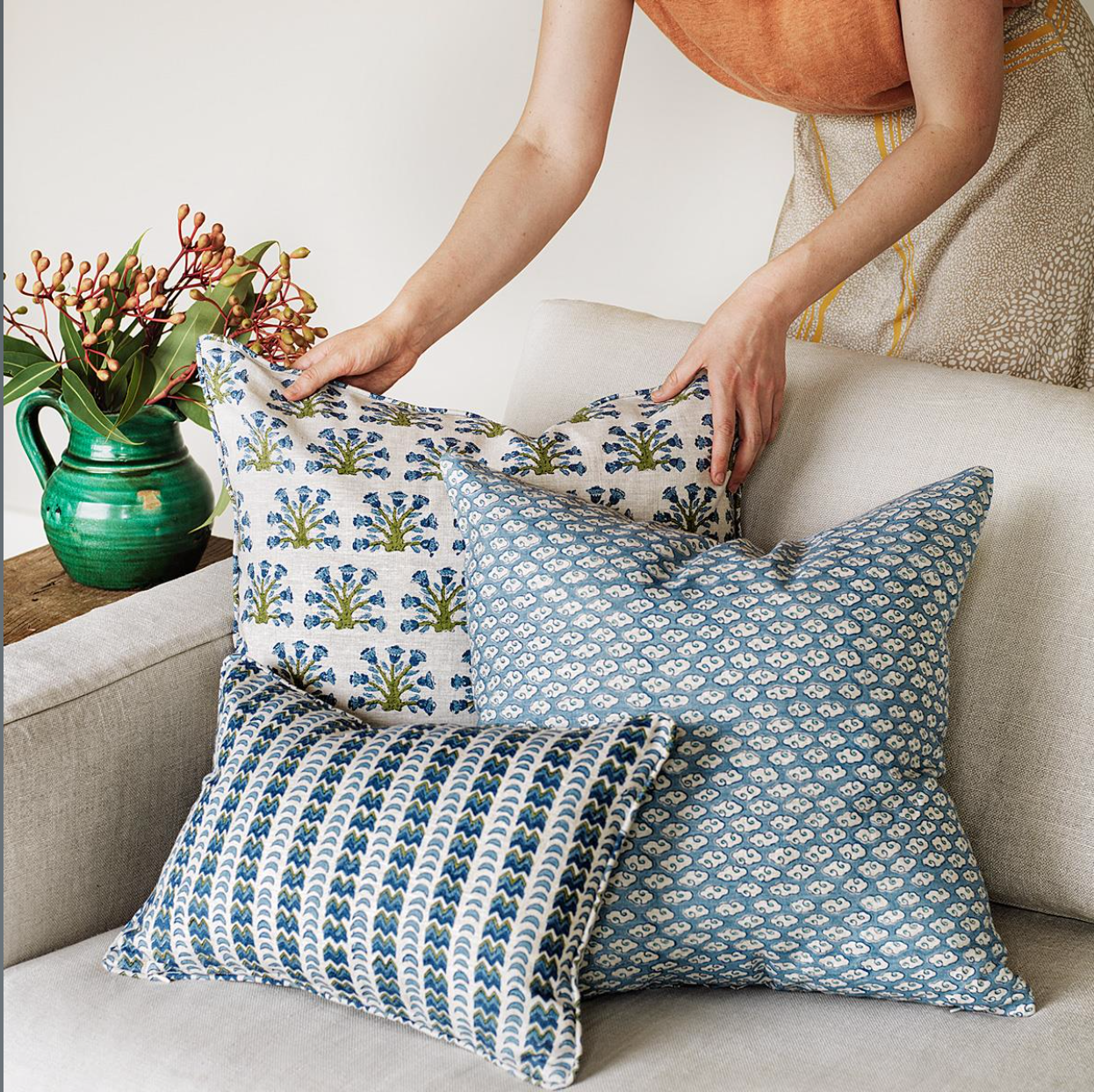 collection of blue and green pillows